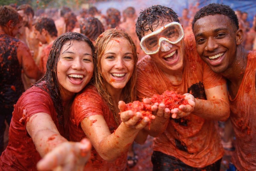 Is La Tomatina Safe to Attend for tourists featuring a group of party goers